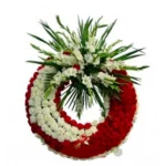Corona fúnebre de claveles rojos y blancos