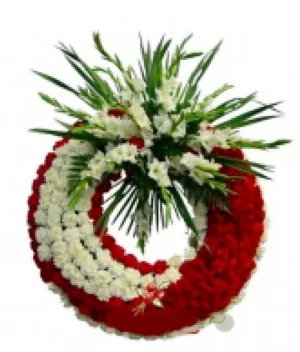 Corona fúnebre de claveles rojos y blancos